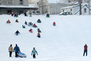 Children Sledding at WinterFest Event