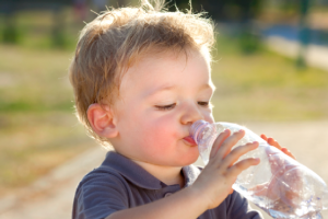 Little boy drinking water